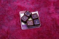 Wooden old playing dice. Gambling, board game accessories. pink
