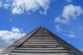 Wooden old rusty roof pattern with blue cloudy sky Royalty Free Stock Photo