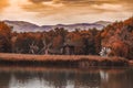 Wooden old windmills on lake in Astra Museum Sibiu Romania in autumn Royalty Free Stock Photo