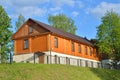 Wooden one-storeyed apartment house on the embankment of the riv