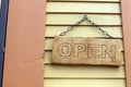 Open closed sign hanging from chain on old building Royalty Free Stock Photo