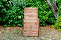 Wooden open in home garden compost bin with organic material Royalty Free Stock Photo