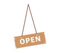 Wooden open sign hanging on a rope. Simple brown signboard announcing store opening. Entrance welcoming store or