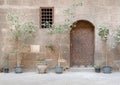 Wooden ornate door and small window with wooden grid, Cairo