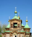 Wooden orthodox church with golden cross on the roof Royalty Free Stock Photo