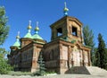 Wooden orthodox church with golden cross on the roof Royalty Free Stock Photo