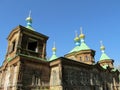 Wooden orthodox church with golden cross on the roof Royalty Free Stock Photo