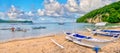 Wooden outriggers on a beach on a tropical island in the Philippines.