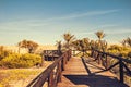 Wooden footbridge to Guardamar beach over sand dunes. mediterranean landscape. Guardamar, Alicante. Spain Royalty Free Stock Photo