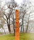 Wooden pagan idol or god Perun outdoors. The concept of religious rites. Close-up