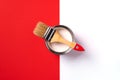 Wooden paint brush, open paint can on trendy red and white background. Top view, copy space. Appartment renovation Royalty Free Stock Photo