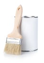Wooden paint brush with paint tin close-up on white background. Royalty Free Stock Photo