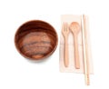 Wooden pair chopstick set with spoon and fork put on recycle brown napkin prepare for serve. circle wood brown abstract textured.