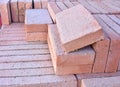 wooden pallet plenty of old stacked red bricks. The bricks are ordered in many rows Royalty Free Stock Photo