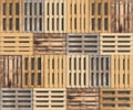 Wooden pallets of different colors and shapes lie in a row in a top view. Seamless texture or background. Creative decorative