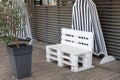 Wooden pallets make white paint garden wood lounge chair seat  in home garden outdoor Royalty Free Stock Photo