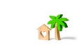 Wooden palm tree and house with hearts on an isolated background. Conceptual leisure and vacation. Rental homes and properties Royalty Free Stock Photo