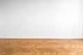 Wooden parquet floor and white wall background - empty room , ne Royalty Free Stock Photo