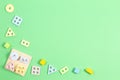 Wooden pastel color geometry educational toy for children on light green background. Educational shape color recognition Royalty Free Stock Photo