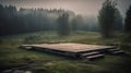 Wooden patform in a foggy meadow in the morning