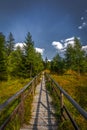 Wooden path around small march near stone labyrinth Bledne skaly Royalty Free Stock Photo