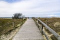 Wooden path at Baltic sea over sand dunes with ocean view Royalty Free Stock Photo