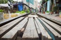 Wooden path crossing railway rail in Vietnam. Concept of unsafe railway