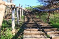 Wooden path with a handrail on the earth Royalty Free Stock Photo