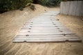 Wooden path on sand Royalty Free Stock Photo