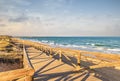 Wooden path parallel to the sea to access the beach on the sand dunes Royalty Free Stock Photo