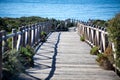 Wooden path on sand dunes close to the sea Royalty Free Stock Photo