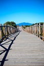 Wooden path on sand dunes close to the sea Royalty Free Stock Photo