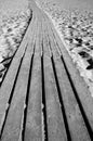 Wooden path through a sandy beach Royalty Free Stock Photo