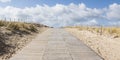 Wooden path sea over sand dunes with ocean view Royalty Free Stock Photo