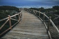 Wooden path to calm sea in evening Royalty Free Stock Photo