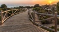 Wooden path to sea during sundown Royalty Free Stock Photo