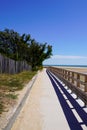 Wooden pathway access french sea coast with sunny atlantic beach in summer day