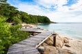 Wooden pathway built on a rocky coast  at Koh Munnork island , Rayong, Thailand Royalty Free Stock Photo