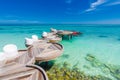 Maldives loungers and wooden pathway and sea view. Relaxing Maldives island outdoor beach scene Royalty Free Stock Photo