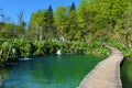 Wooden pathway leading across a lake at Plitvice lakes national park