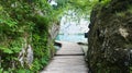 Wooden pathway over the water between rocks, Plitvice Lakes in Croatia, National Park Royalty Free Stock Photo