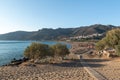 Wooden pathway to sandy beach at Palaiochora town at southern part of Crete island, Greece. Royalty Free Stock Photo