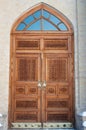 Wooden pattern in door with boor handle in Tashkent, Uzbekistan