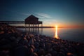 Wooden pavilion on a beach on the coast against a scenic sunset in Bregenz Royalty Free Stock Photo