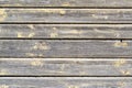 Wooden peeling wall. Old painted at yellow color boards. Textured Background. Royalty Free Stock Photo