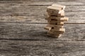 Wooden pegs build in a tower like structure wth some of them reading words that represent the most important elements in the way Royalty Free Stock Photo