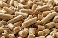 Wooden pellets macro background. Texture of compressed sawdust granules. Alternative energy for home heating. Ecological biofuel Royalty Free Stock Photo
