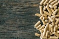 Wooden pellets on old wooden background