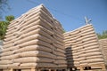 Wooden pellets in plastic bags on a beg stacks Royalty Free Stock Photo