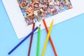 Wooden pencil shavings from sharpener and colored pencils Royalty Free Stock Photo